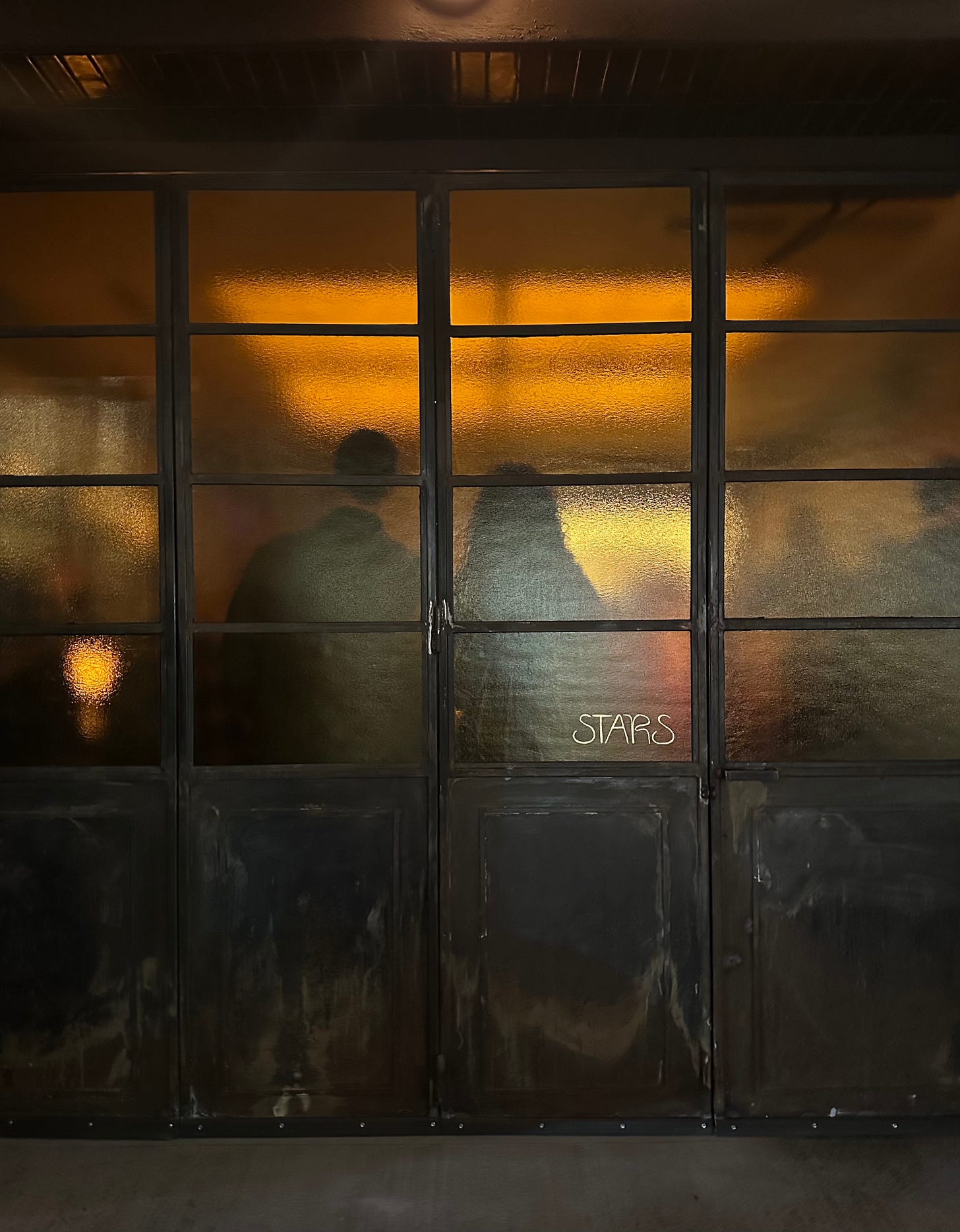 Owner Chase Sinzer and wine director Julia Schwartz, from the outside of Stars.