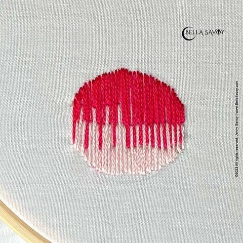 pink and red circle made with the long and short stitch