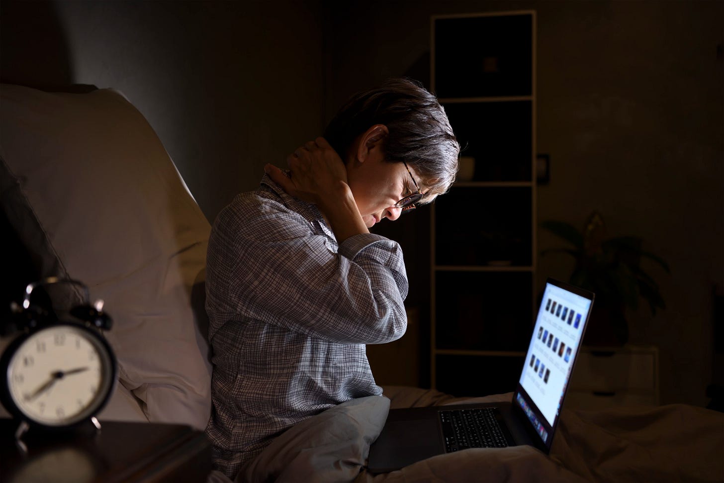 Woman suffering from tech overload.