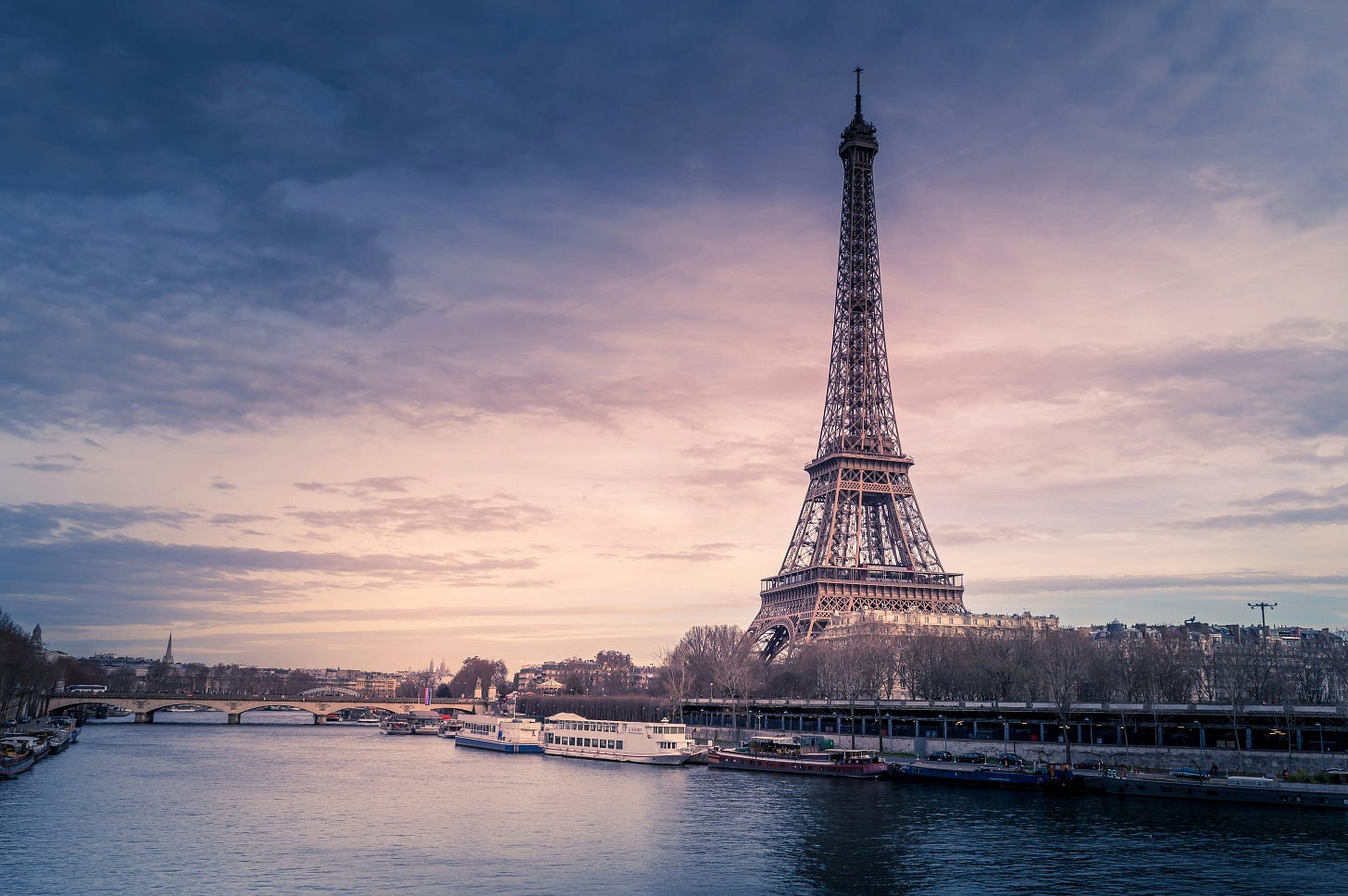 The Eiffel Tower in front of the Seine in Paris The Eiffel Tower in front of the Seine in Paris