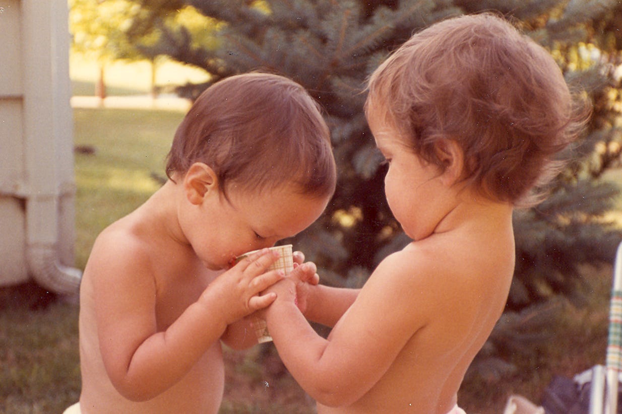 Sharing a drink with her brother