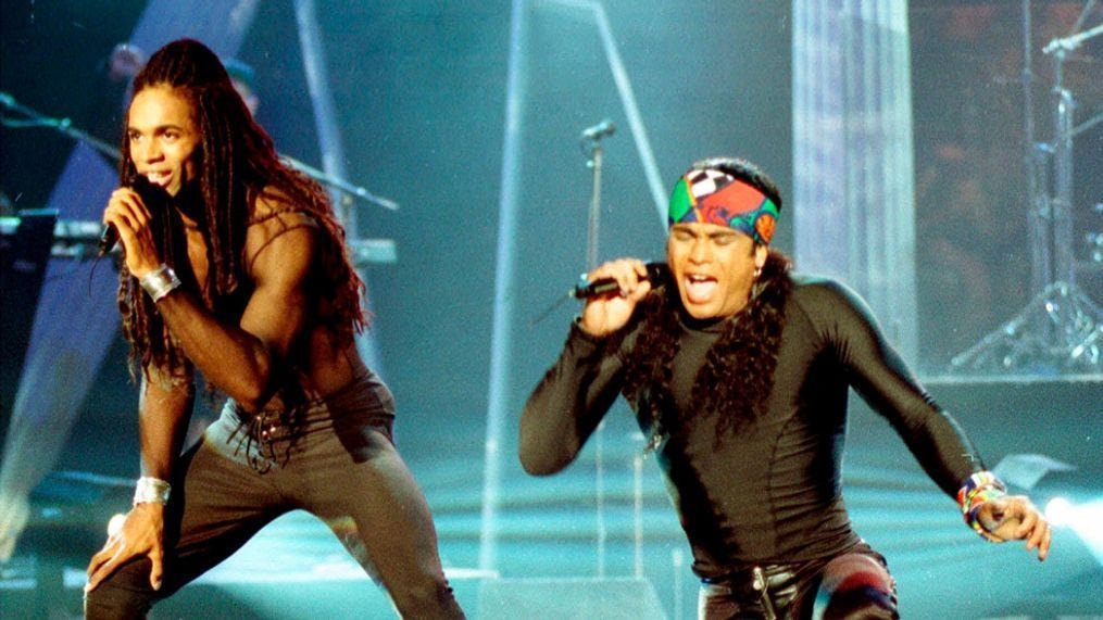 FILE - In this Oct. 26, 1992 file photo, Fabrice Morvan, left, and Rob Pilatus of Milli Vanilli perform during the taping of the Arsenio Hall Show in Los Angeles. (AP Photo/Craig Fujii, File)