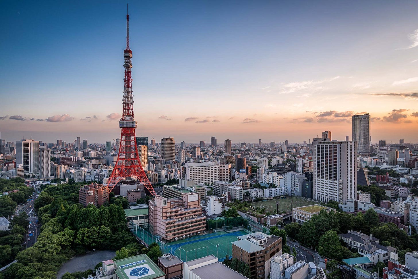 a large city with a red tower