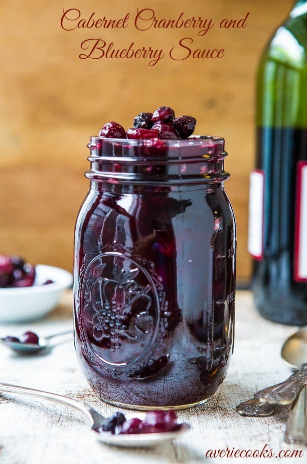 Cabernet Cranberry and Blueberry Sauce (vegan, GF) - Make your own cranberry sauce with amazing depth of flavor in 30 minutes! Easy recipe at averiecooks.com A mason jar full of cabernet cranberry and blueberry sauce.