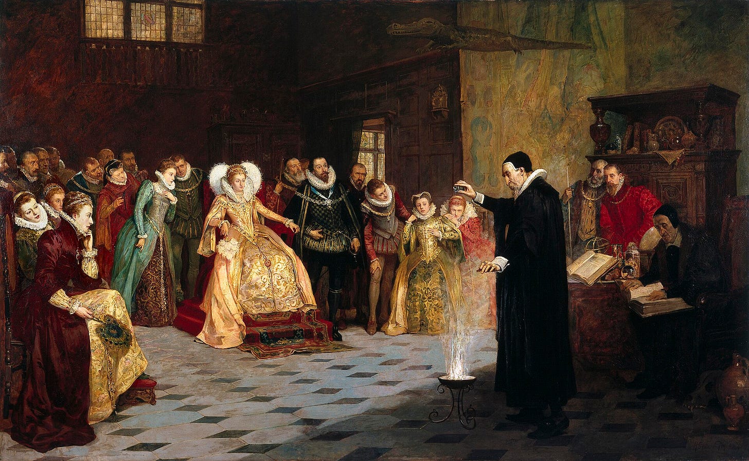 In a paneled room, a tall man in a black gown and skullcap holds his hand over a small flaming brazier on the floor, while Queen Elizabeth I in a gold dress watches from her chair among courtiers. In a paneled room, a tall man in a black gown and skullcap holds his hand over a small flaming brazier on the floor, while Queen Elizabeth I in a gold dress watches from her chair among courtiers.