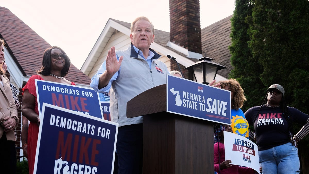 Mike Rogers speaks in front of 'Democrats for Mike Rogers' signs in Detroit on Aug. 20, 2026 Mike Rogers speaks in front of 'Democrats for Mike Rogers' signs in Detroit on Aug. 20, 2026