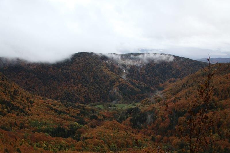 Photo of mountain range covered by clouds