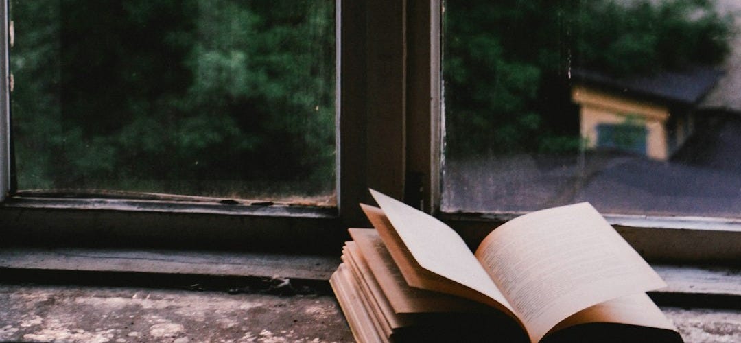 book near glass window