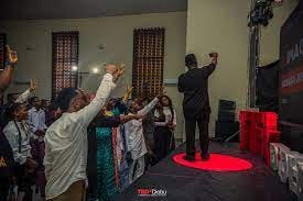 Selected pictures from TEDxDiobu, showing logos, venue shots and panelists