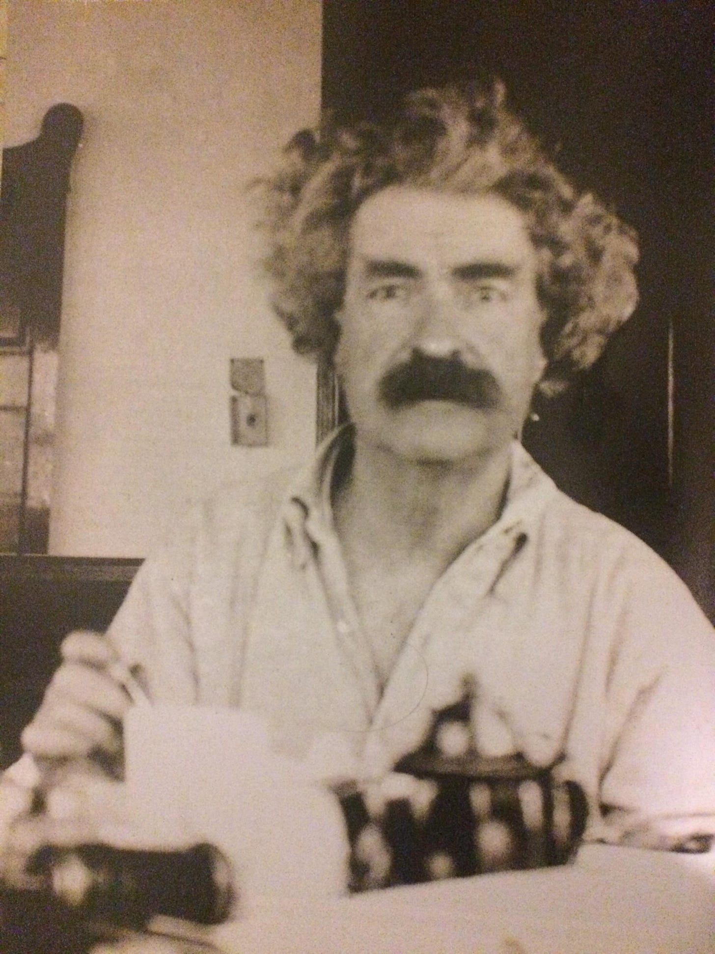 A candid moment with literary giant Mark Twain enjoying breakfast in the 1890s.