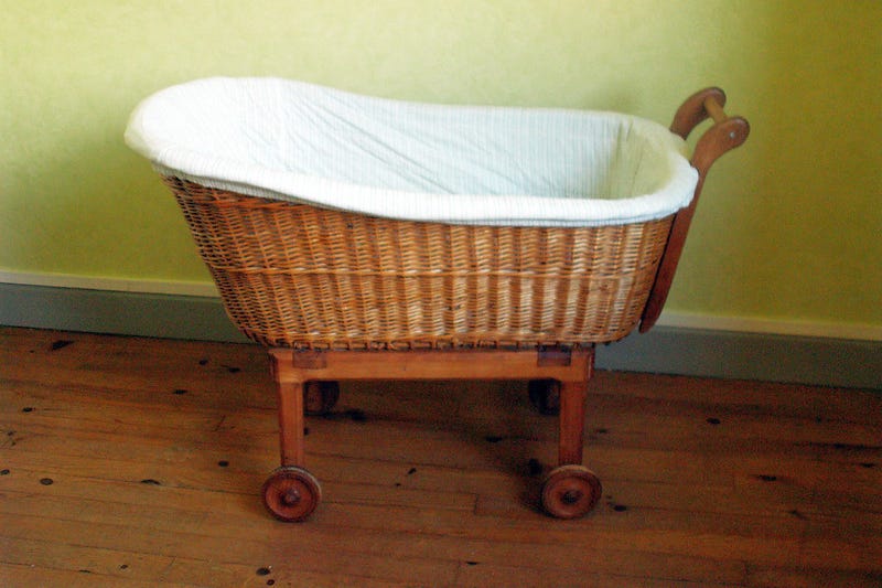 An old fashioned wicker cradle