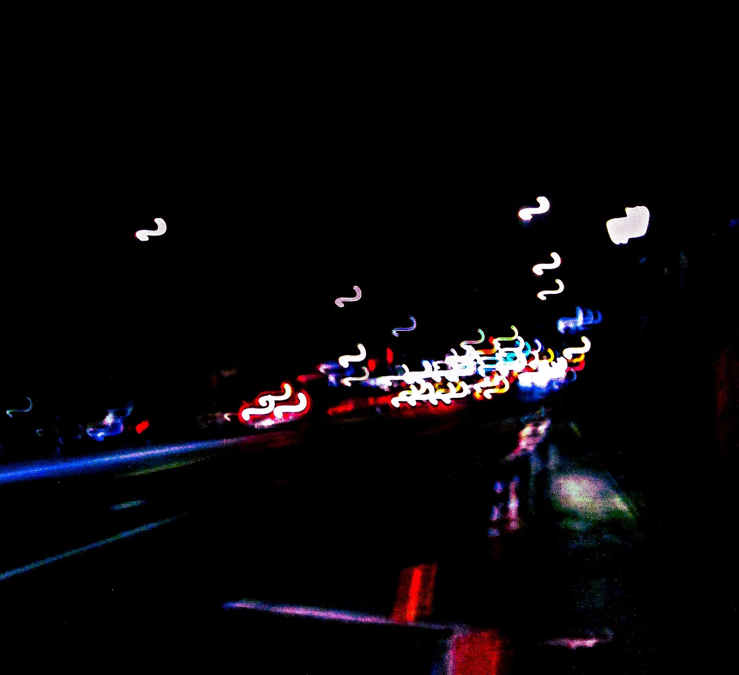 Photo with neon squiggly lights on black background
