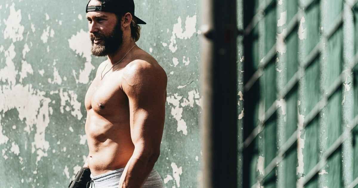 man standing beside wall during daytime man standing beside wall during daytime