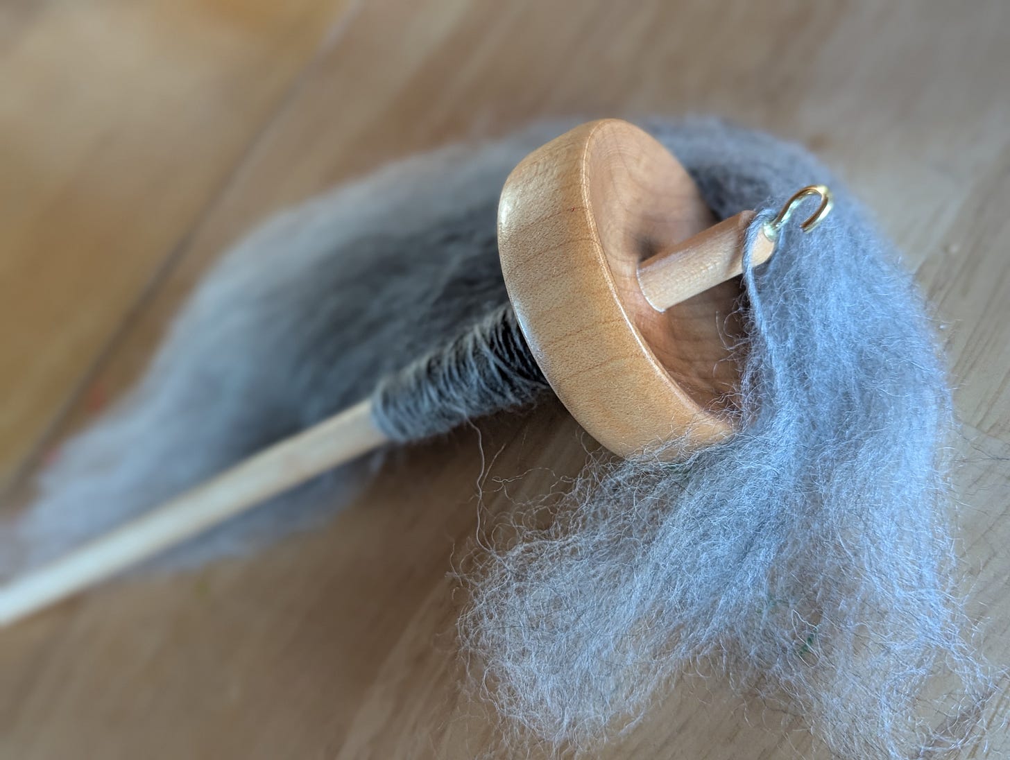 blue handspinning yarn on spindle