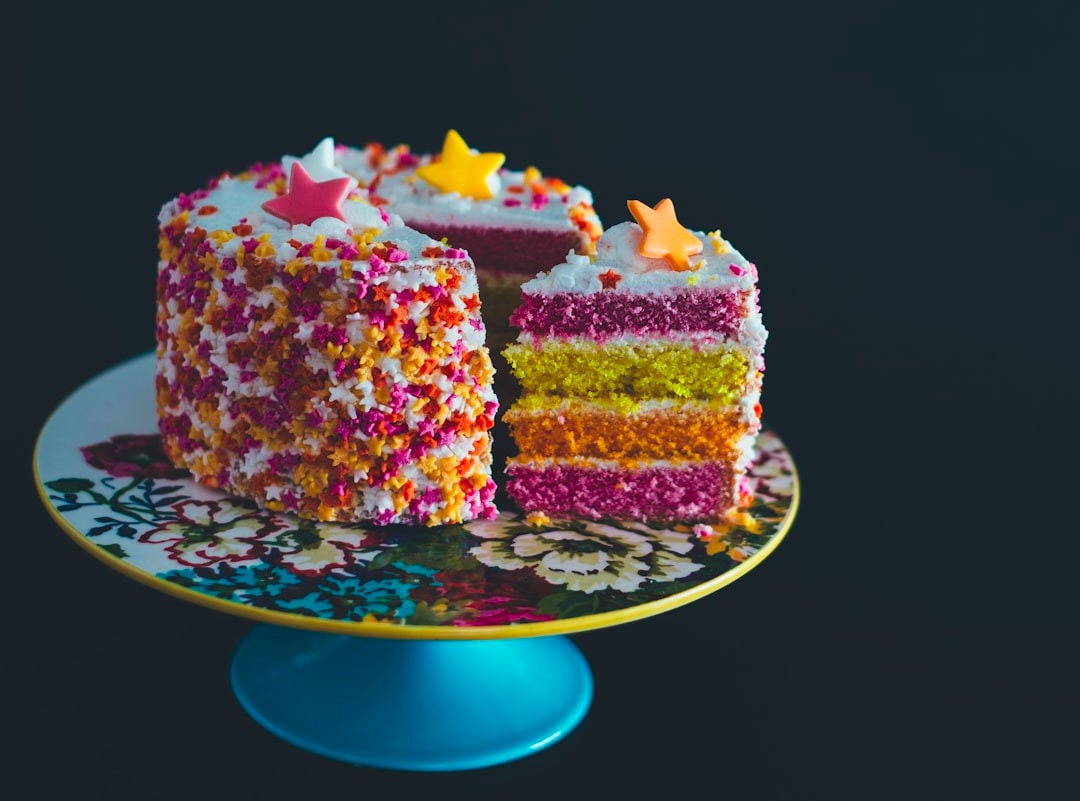 sliced cake top with star raisins on cake stand sliced cake top with star raisins on cake stand