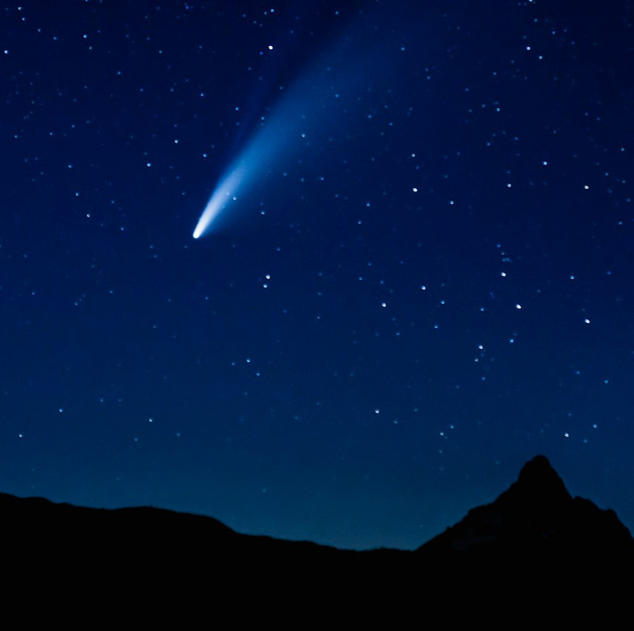 silhouette of mountain under blue sky during night time