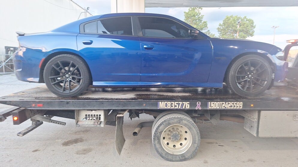 May be an image of car and text