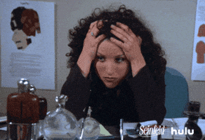 Seinfeld gif. Julia Louis-Dreyfus as Elaine sitting with her elbows on the desk, head in her hands, looking stressed. Seinfeld gif. Julia Louis-Dreyfus as Elaine sitting with her elbows on the desk, head in her hands, looking stressed.