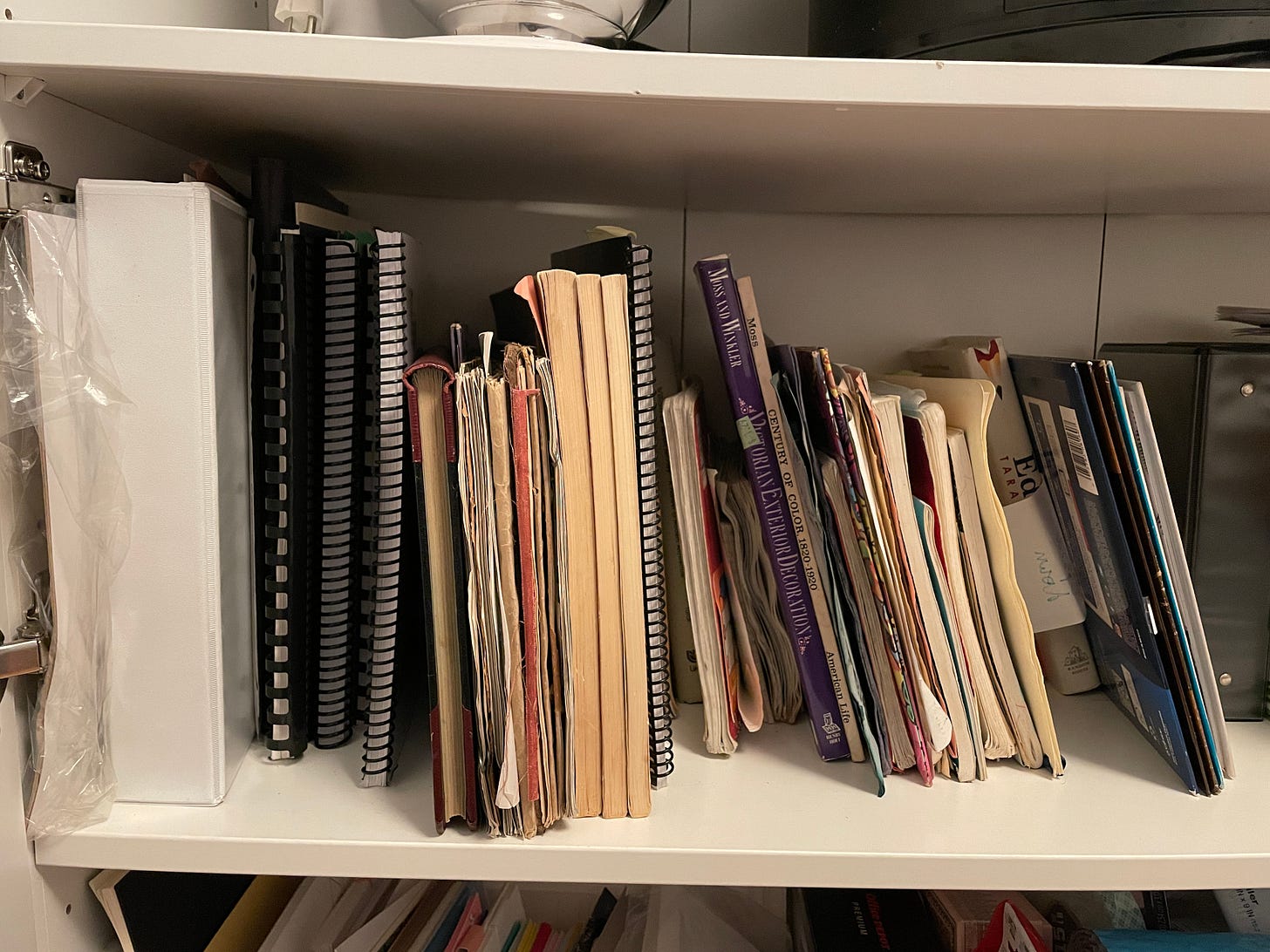 Messy bookshelf with notebooks, documents, books, and papers. Messy bookshelf with notebooks, documents, books, and papers.