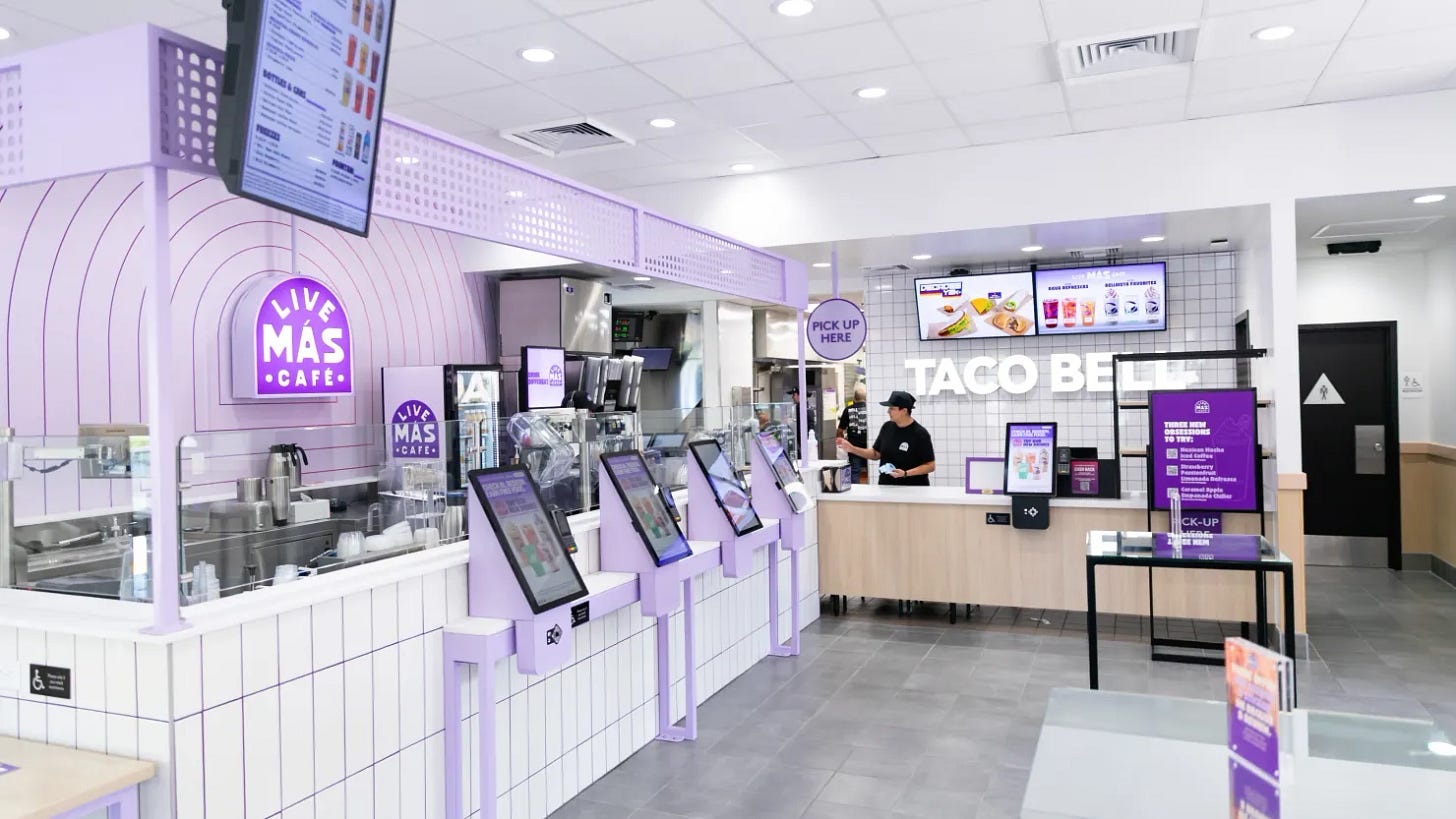 A crisp, clean Taco Bell interior with a Live Mas cafe counter on one side