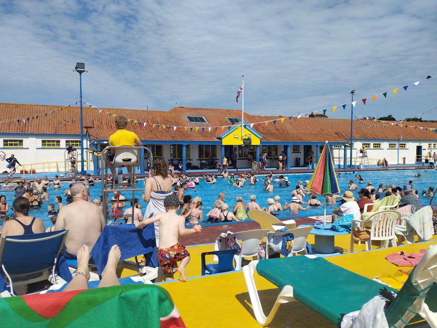 A busy Stonehaven Open Air Pool in the sunshine
