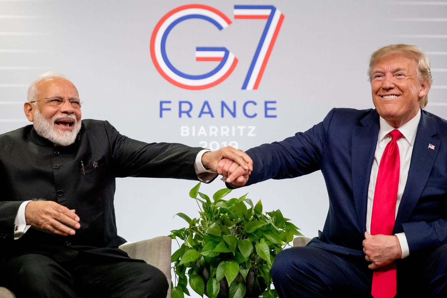 Modi and Trump share a laugh during a meeting at the G-7 summit in Biarritz, France, on August 26.