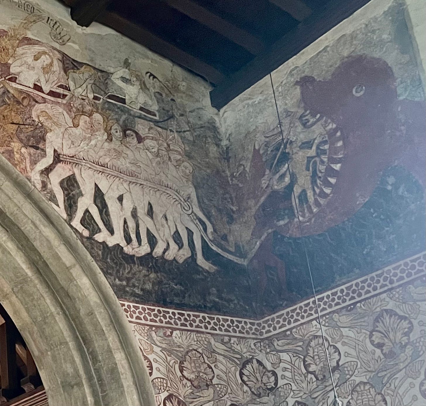 Naked sinners being led into a dragon's mouth
