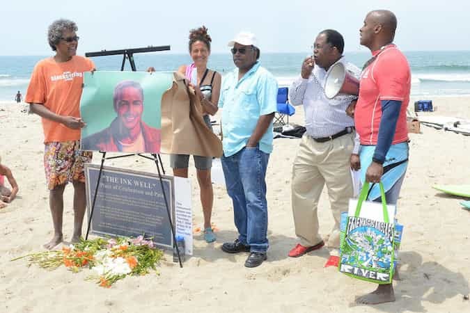 people gather around a picture to honor nick gabaldon people gather around a picture to honor nick gabaldon