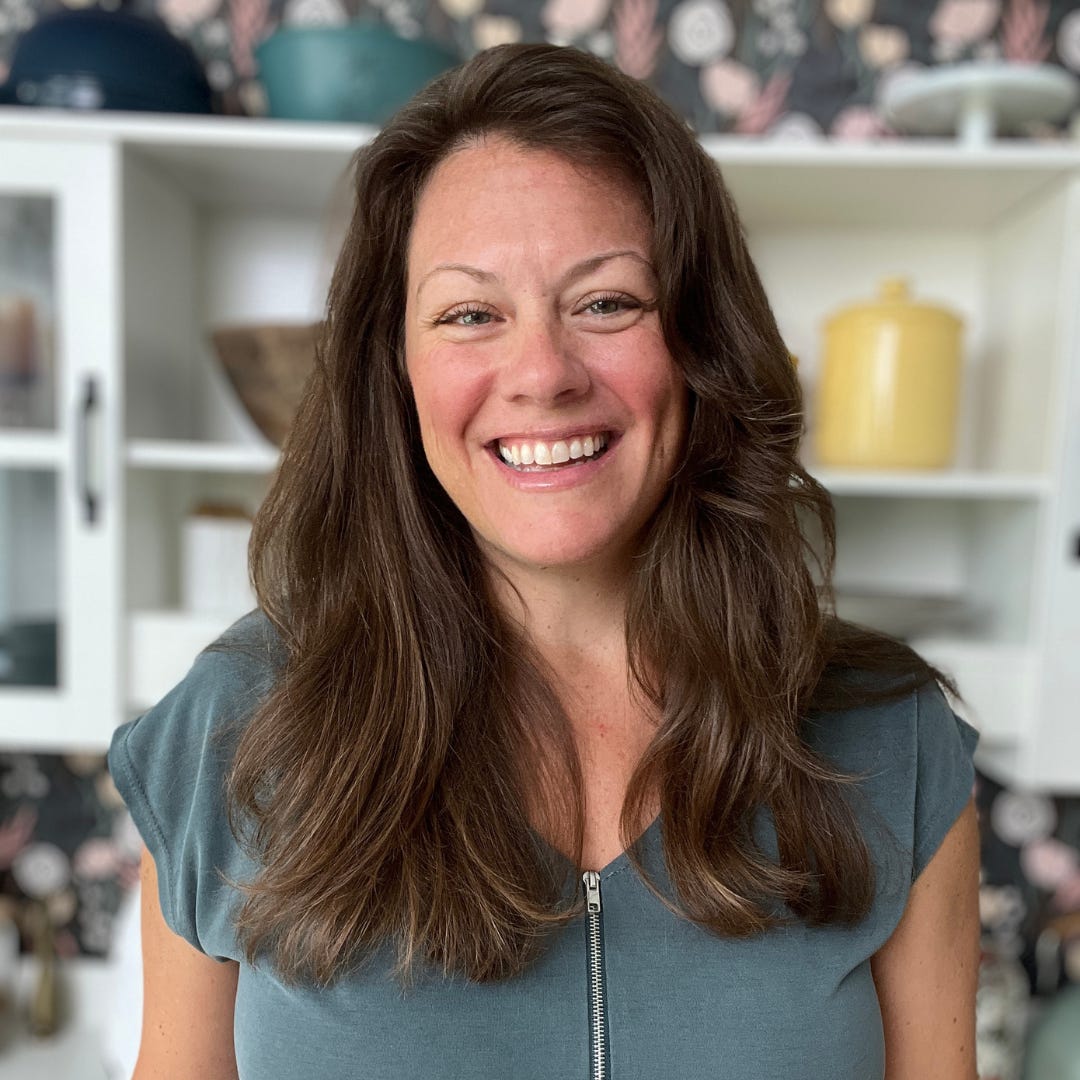 Brett Dupree with long brown hair standing in her kitchen