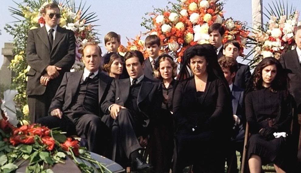 Is it not disrespectful to sit one foot over the other at your fathers  funeral? This scene really bothers me even years after watching the movie.  : r/Godfather