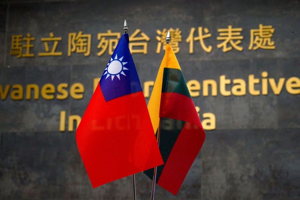 Taiwan and Lithuania flags. (Reuters, Janis Laizans photo)