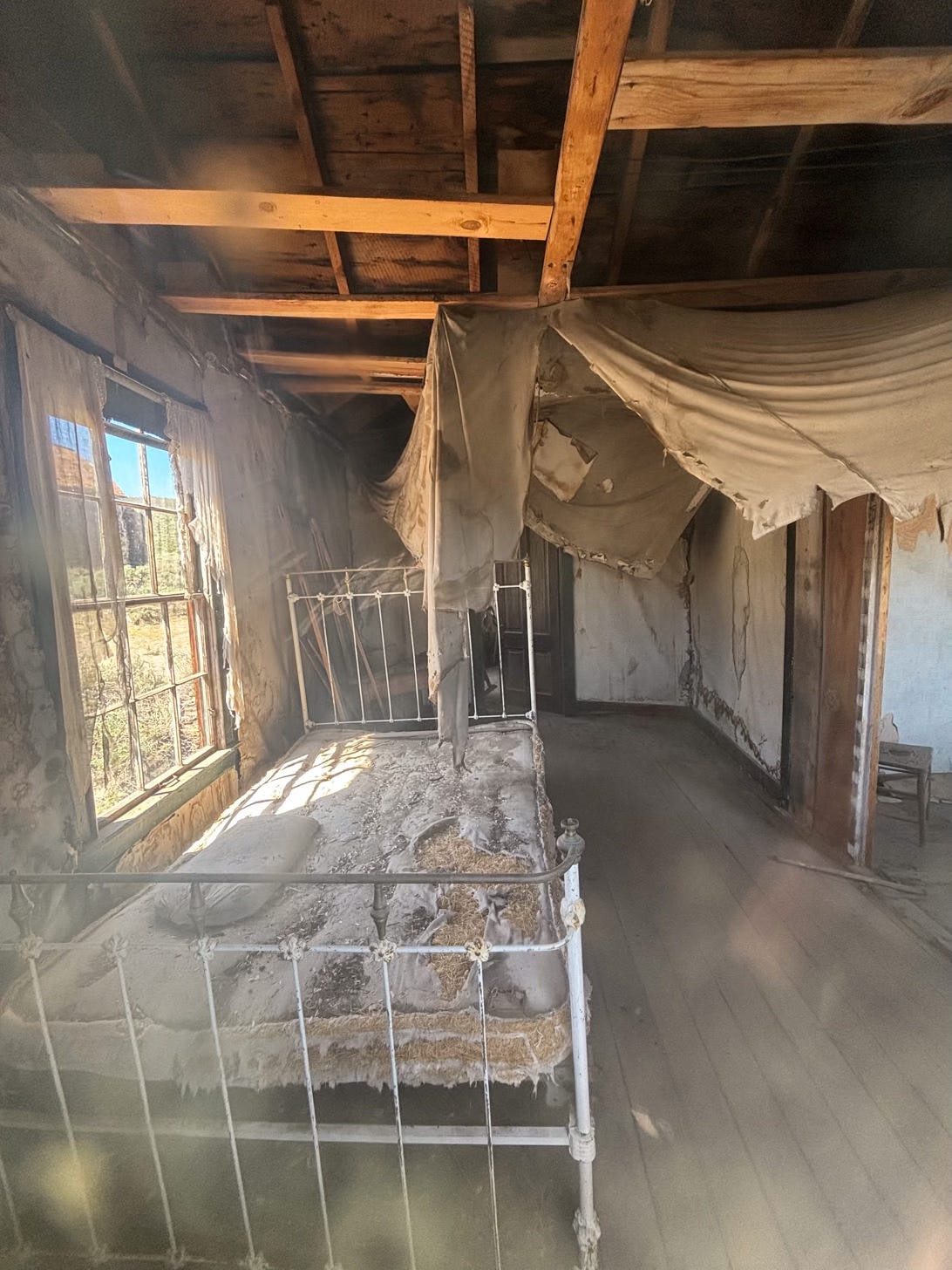 bedroom in decaying ghost town building