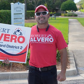 Alvero Tops Hughes For School Board Seat