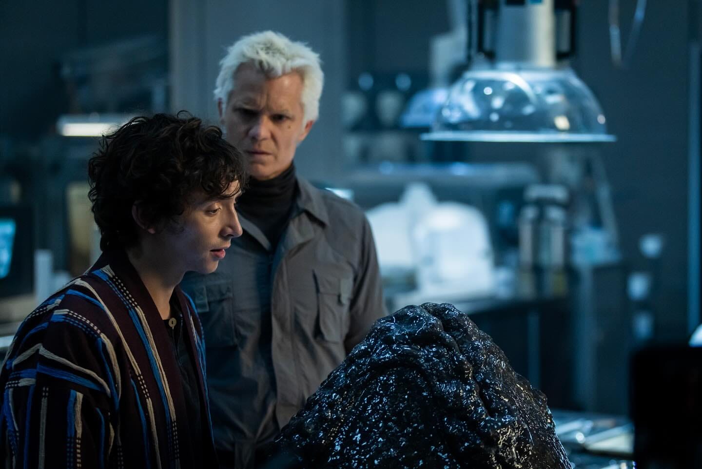 Alien Earth scene, Boy Genius looks directly at a alien egg from a couple of feet away while Kirsh looks at him with confusion and contempt.