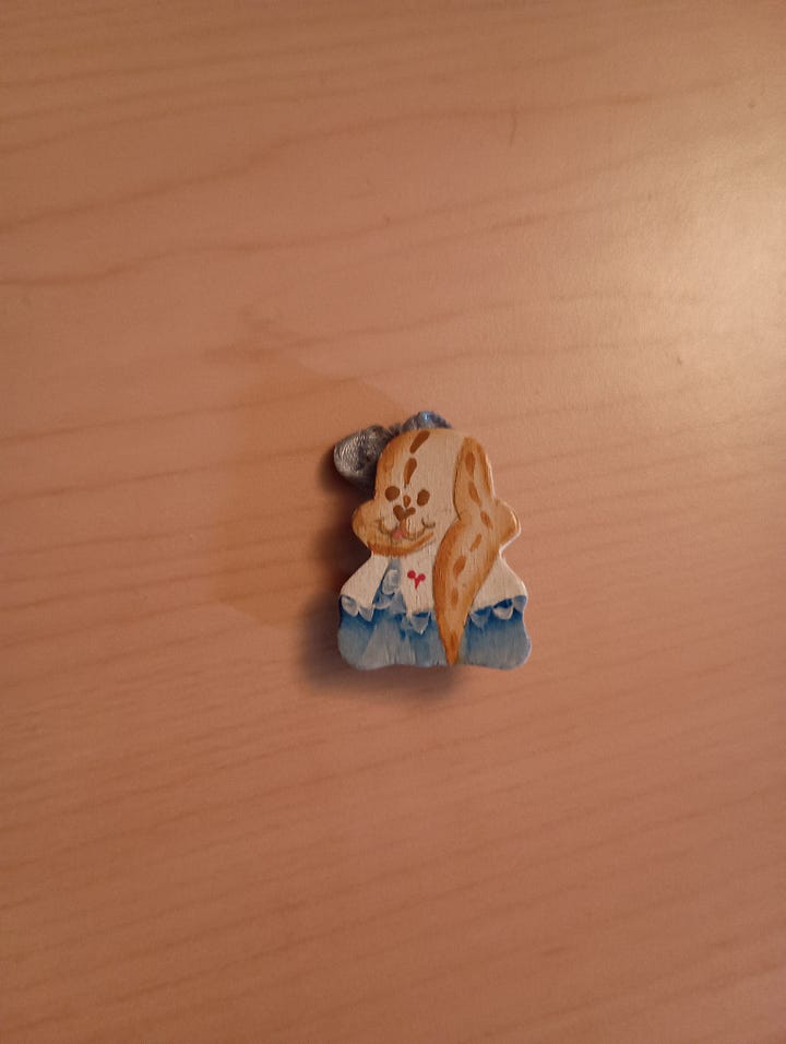 a handpainted dog wearing a blue shirt