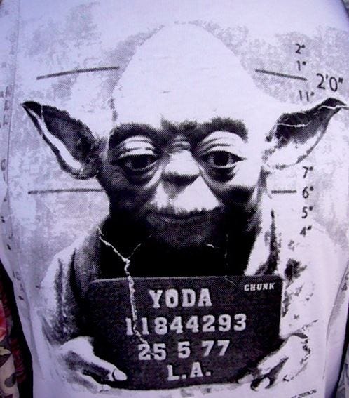 This may contain: the yoda mug shot is displayed on a shirt