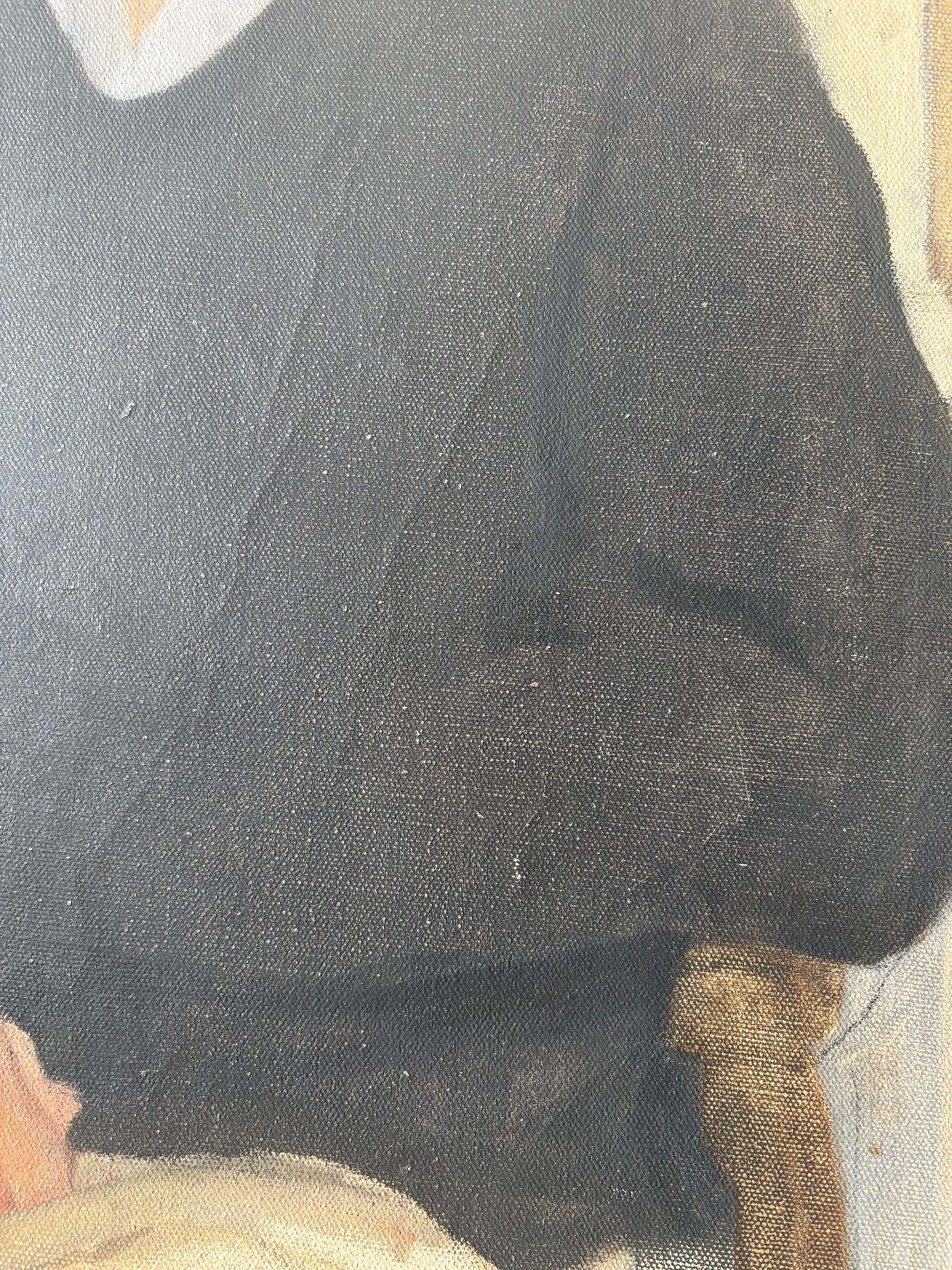 Torso and left arm with hand resting in lap.