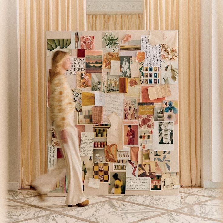 This may contain: a woman is walking in front of a wall covered with pictures and papers on it