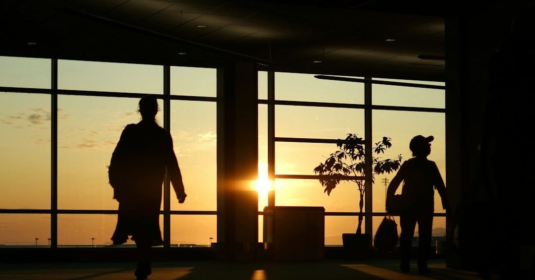 Silhouettes of people against a beautiful sunset. Silhouettes of people against a beautiful sunset.