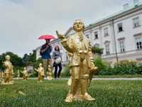 A horde of golden mini-Mozarts marks 270 years since the composer's birth in Salzburg
