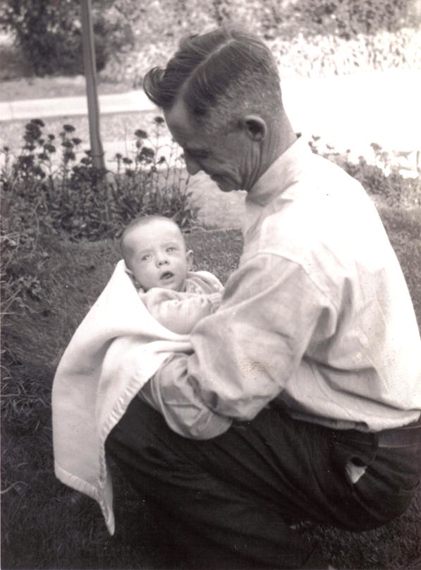 Thomas Tatton with my father James as an infant. Thomas was his maternal grandfather.