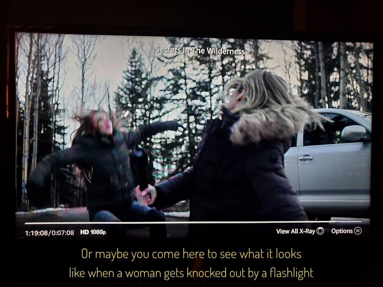 Alana falling away from Lisa as she absorbs a flashlight blow, captioned "Or maybe you come here to see what it looks like when a woman gets knocked out by a flashlight"