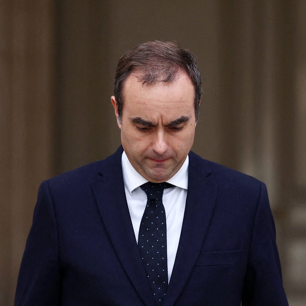 Sébastien Lecornu, head bowed.