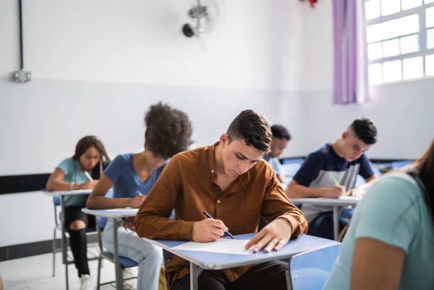 Teeanage students doing a test in the classroom