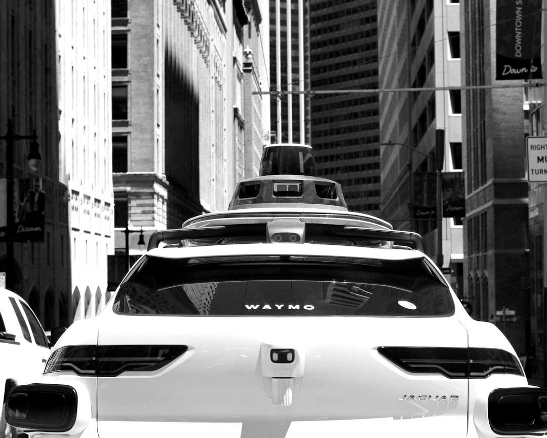 a car that is driving down the street a car that is driving down the street