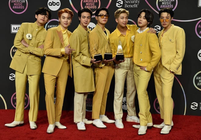 BTS poses in the press room with the awards for favorite pop duo or group, favorite pop song for “Butter,” and artist of the year at the American Music Awards on Sunday, Nov. 21, 2021, at Microsoft Theater in Los Angeles. BTS poses in the press room with the awards for favorite pop duo or group, favorite pop song for “Butter,” and artist of the year at the American Music Awards on Sunday, Nov. 21, 2021, at Microsoft Theater in Los Angeles.