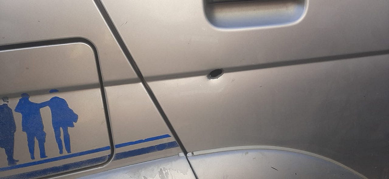 A bullet entry mark in the door of Ahmad Ghunaimat’s car, in which his two young children were sitting, Surif, occupied West Bank, April 23, 2022. (Courtesy) A bullet entry mark in the door of Ahmad Ghunaimat's car, in which his two young children were sitting, Surif, occupied West Bank, April 23, 2022. (Courtesy)