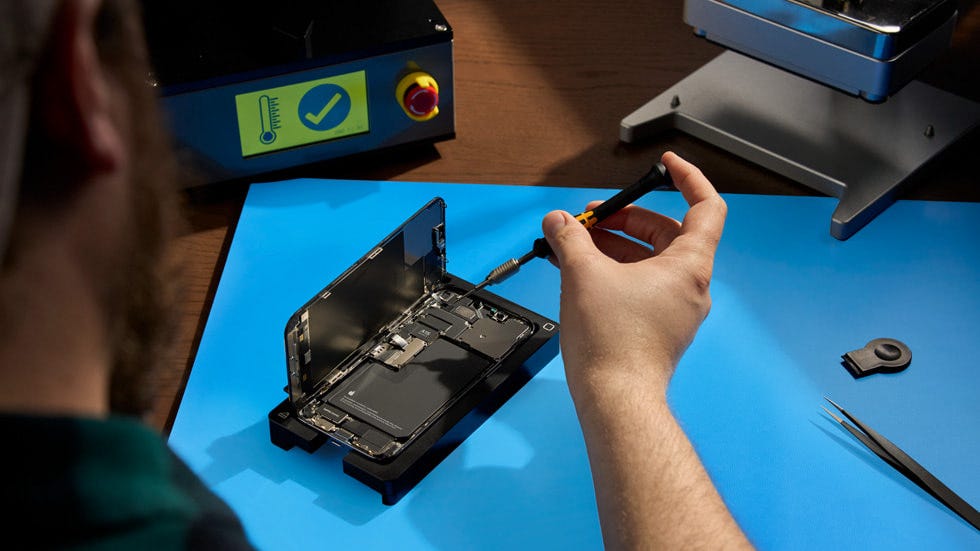 iPhone being repaired with genuine Apple parts and tools through Self Service Repair. iPhone being repaired with genuine Apple parts and tools through Self Service Repair.