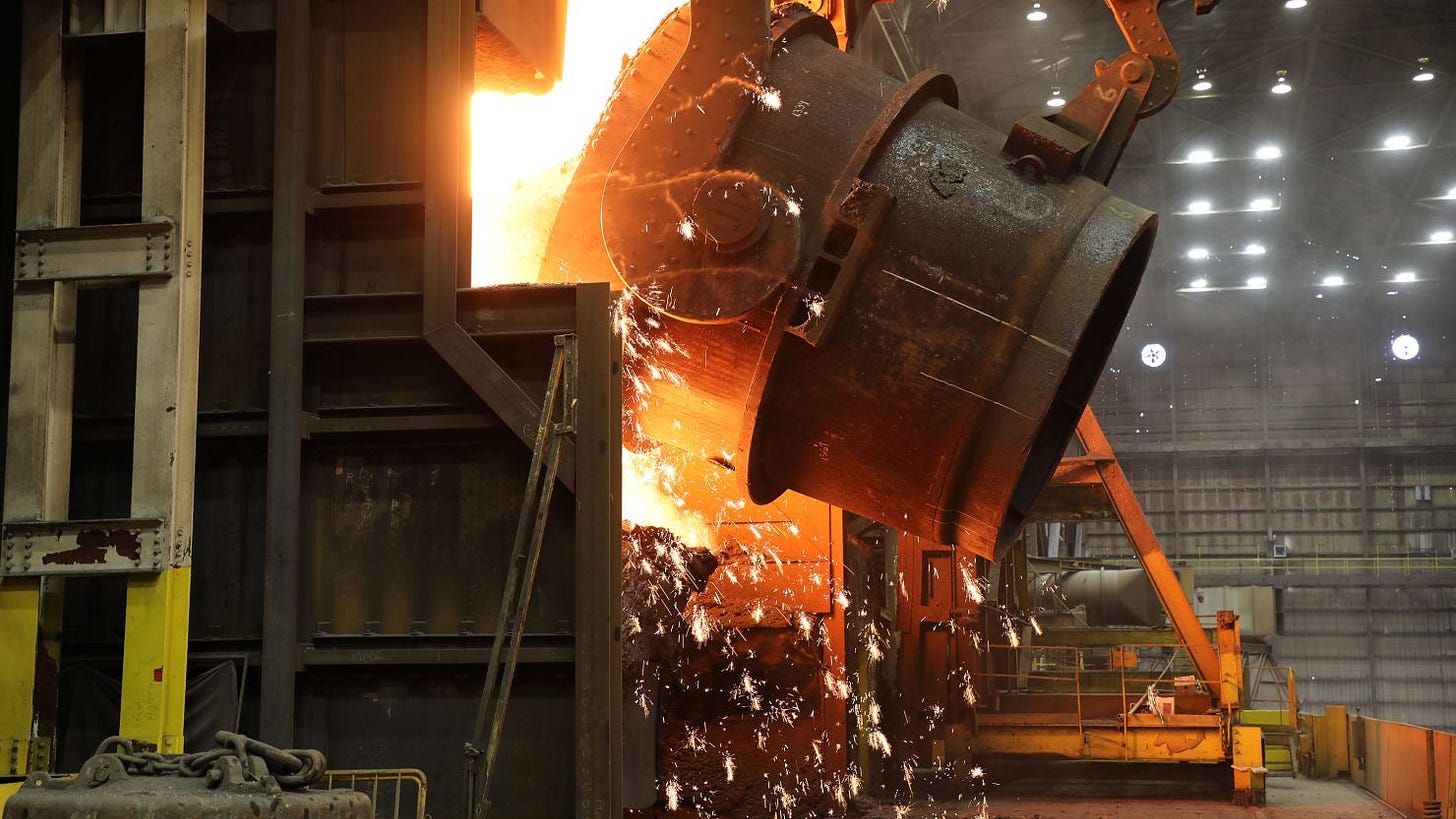 A ladle of molten iron is poured into a Basic Oxygen Process (BOP) furnace at U. S. Steel's Granite City Works, where it will be transformed into liquid steel.