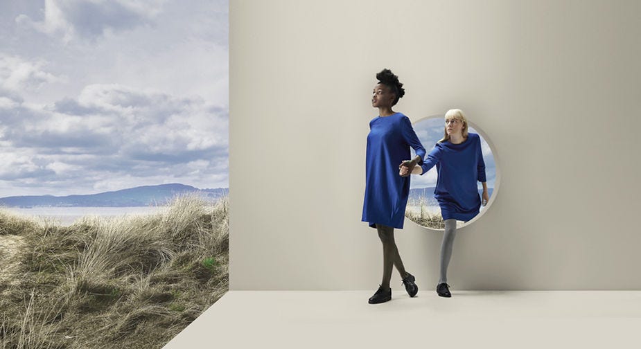 A leader leading an employee over a hurdle.